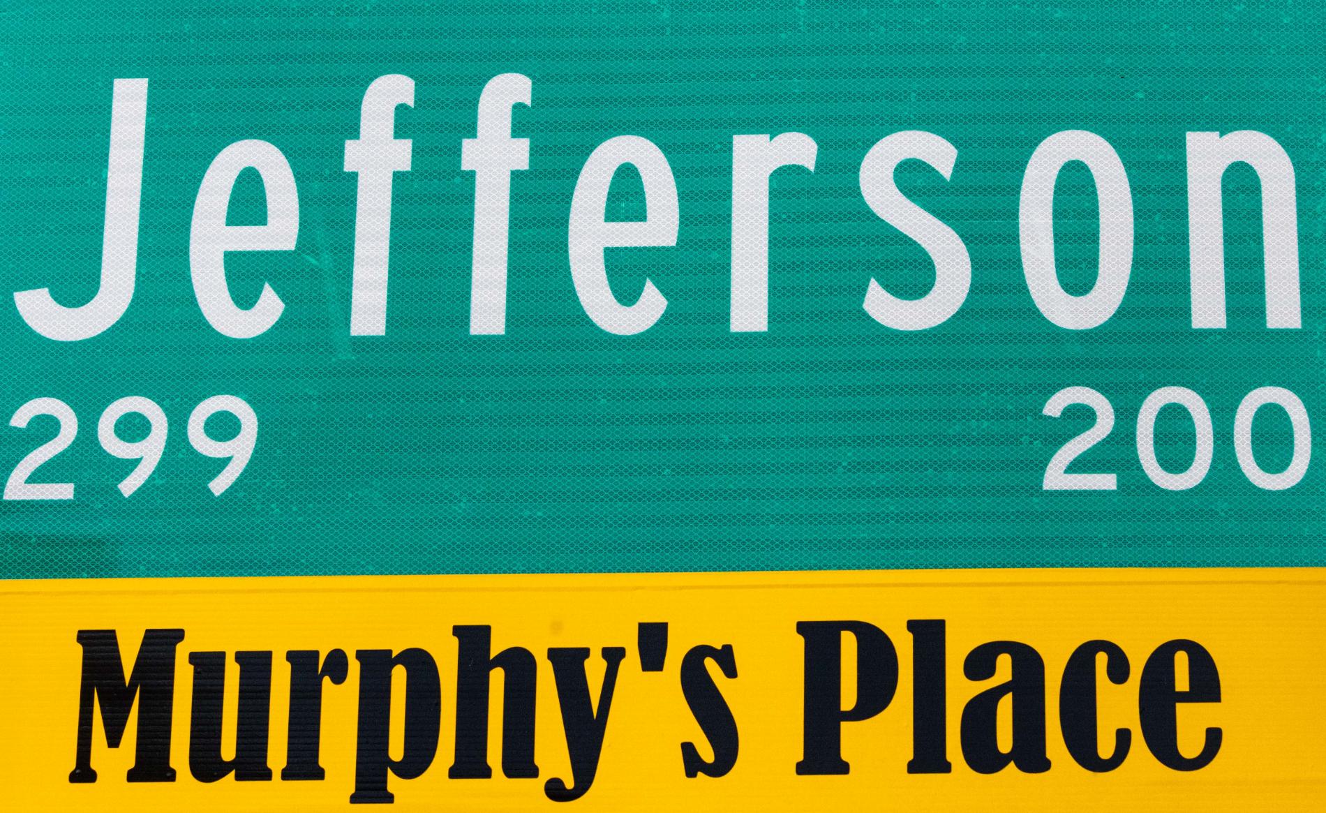 Street sign at Jefferson Avenue marking Murphy's Place